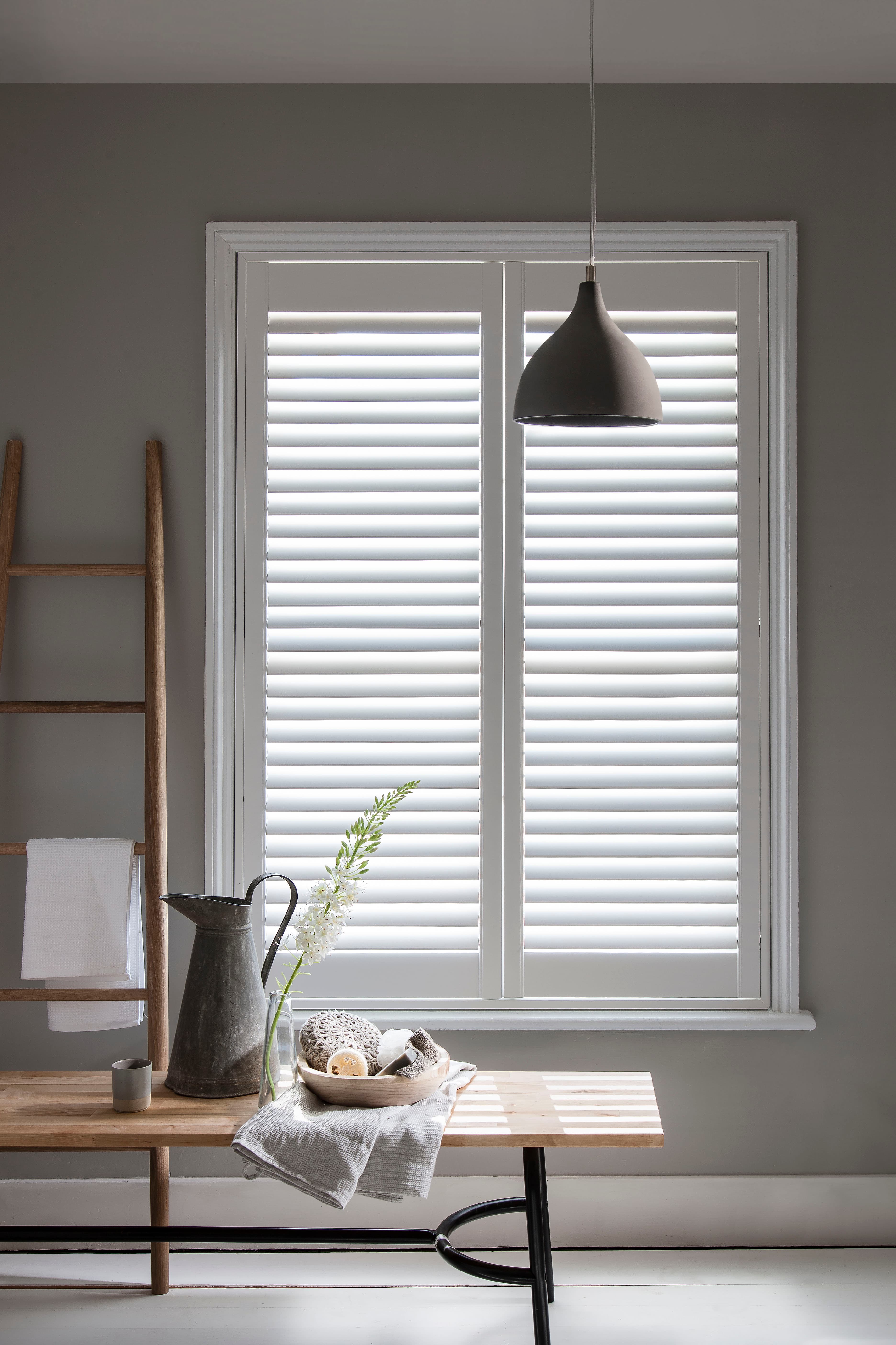 Full height shutters open in a lounge