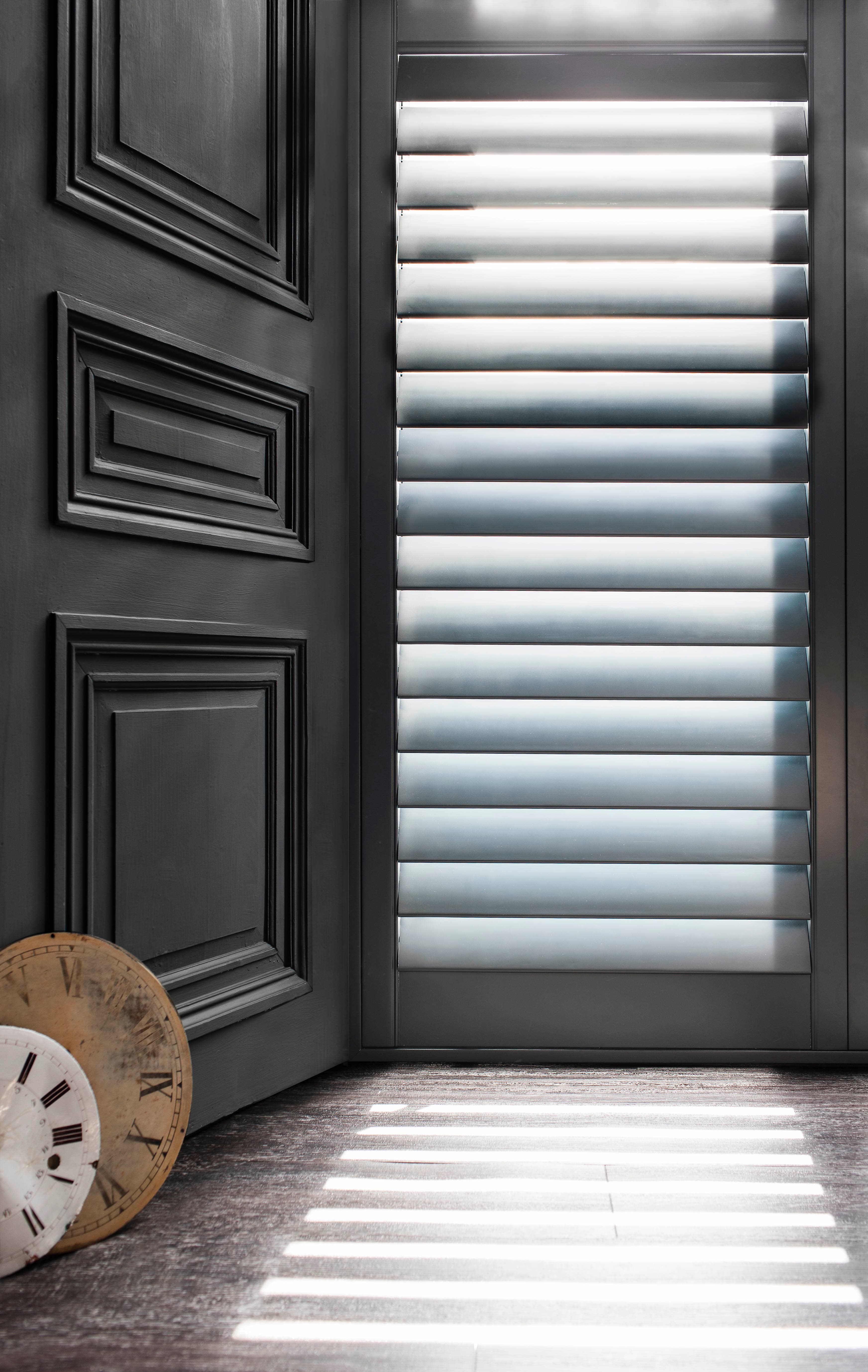 Full height shutters in a bright living room