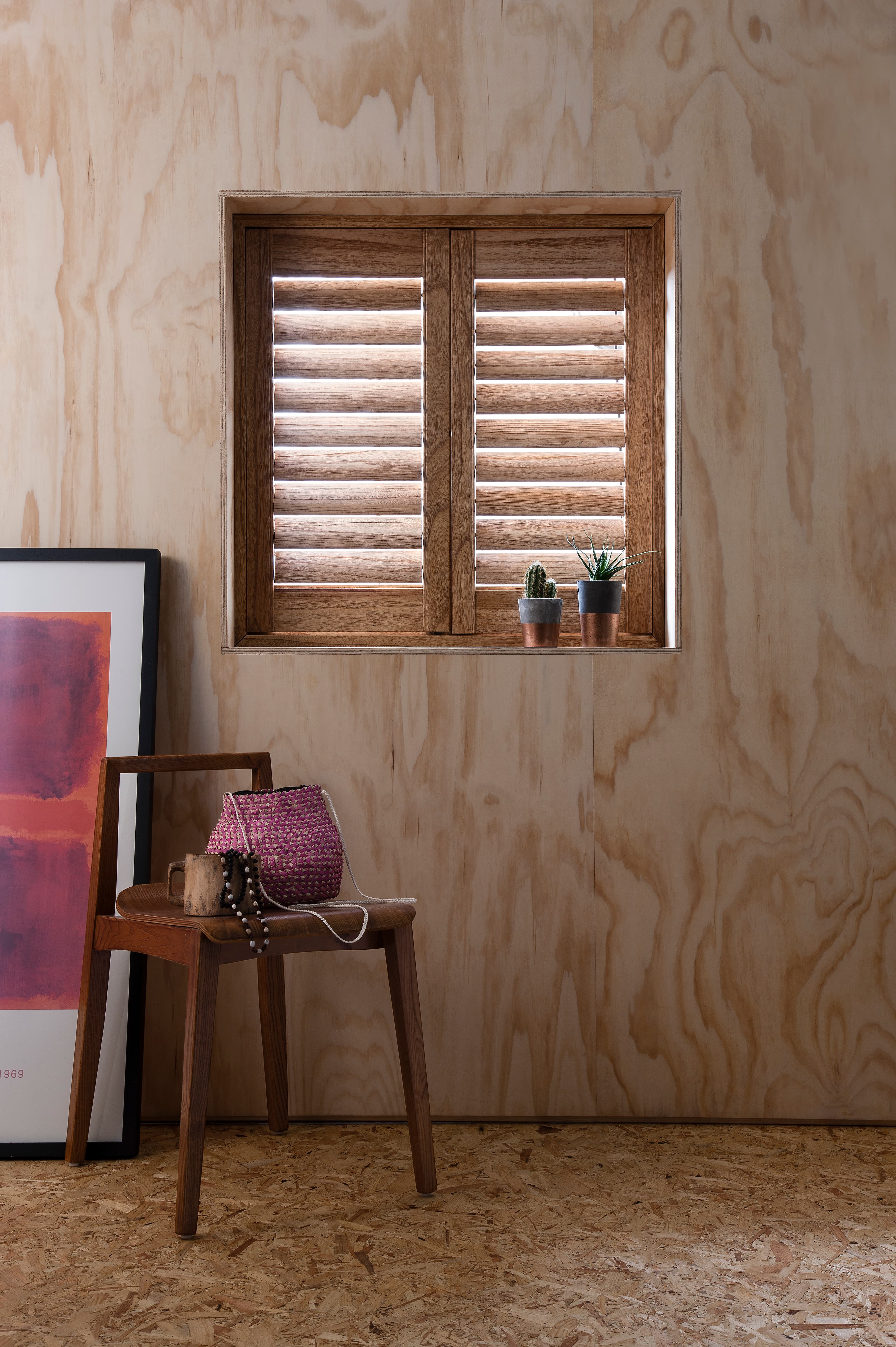 Hardwood shutters showing beautiful natural grain in a bright room